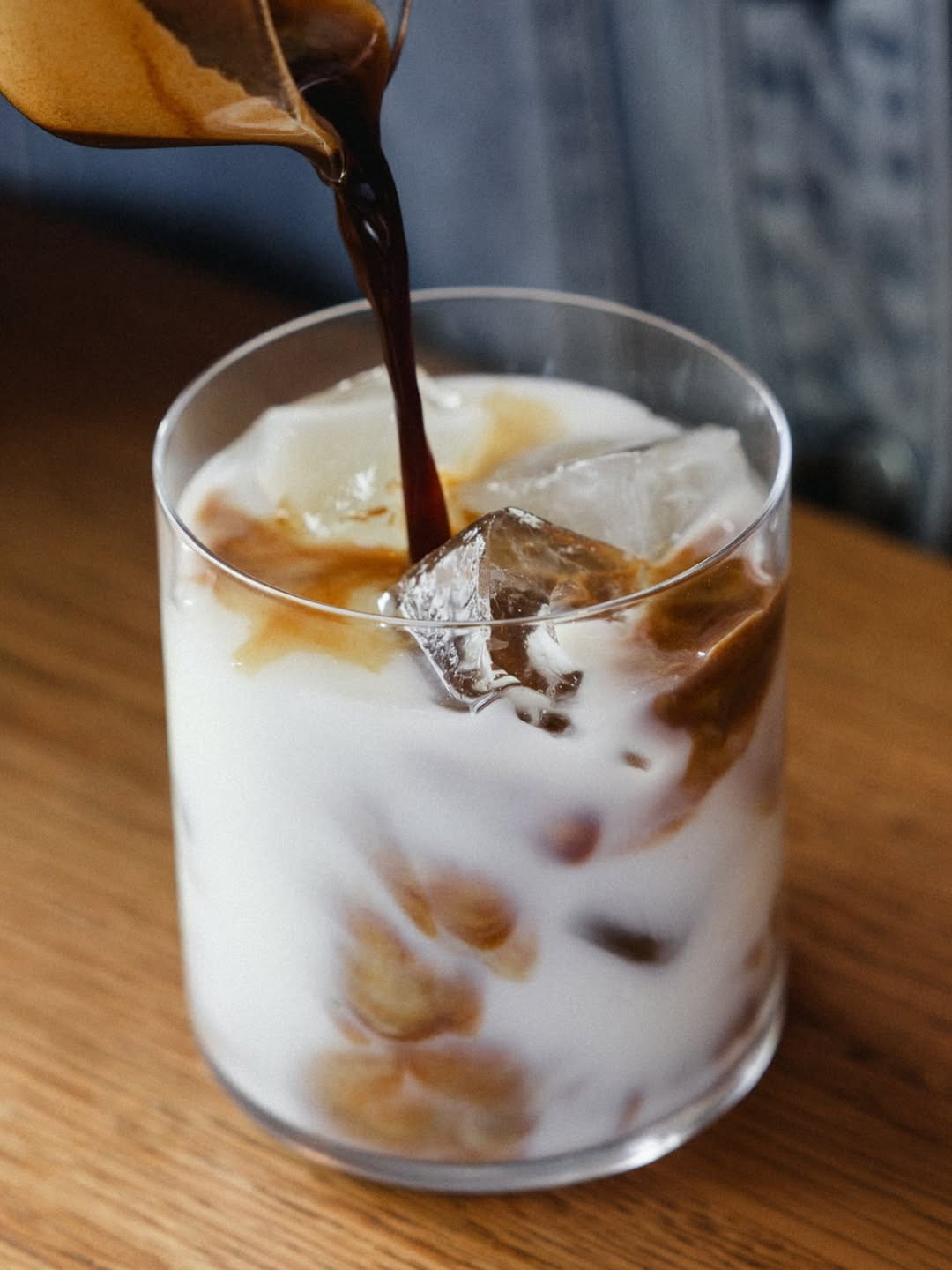 Espresso poured over ice and milk at SANI Bakehouse
